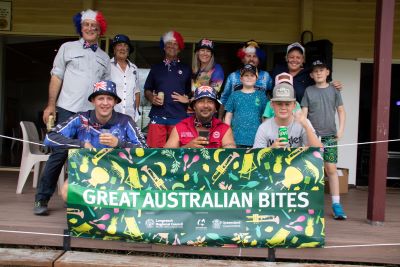 Ilfracombe Group of people behing Great Australian Bites Banner